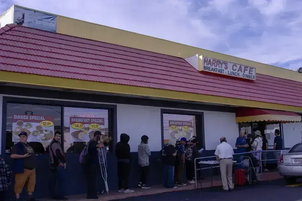 A line of customers waiting outside Harry's Cafe, Katella Ave, Stanton, CA