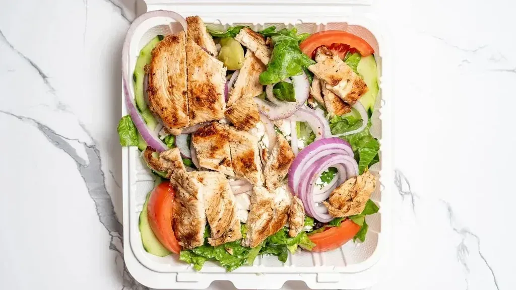 Grilled chicken salad in a takeout container at Harry's Cafe, Katella Ave, Stanton, CA