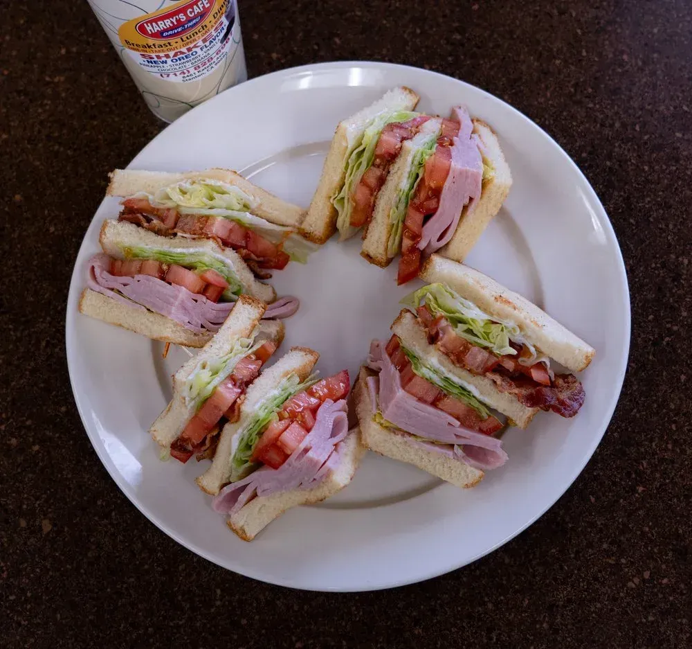 A club sandwich stacked with ham and bacon from the fresh sandwiches menu at Harry's Cafe restaurant, Katella Ave, Stanton, CA