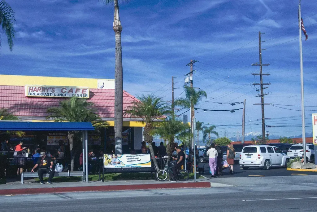 The Harry's Cafe restaurant storefront and drive-thru sign on Katella Avenue, Stanton, CA