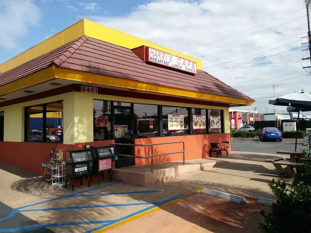 The Harry's Cafe restaurant storefront with its patio tables, Katella Ave, Stanton, CA
