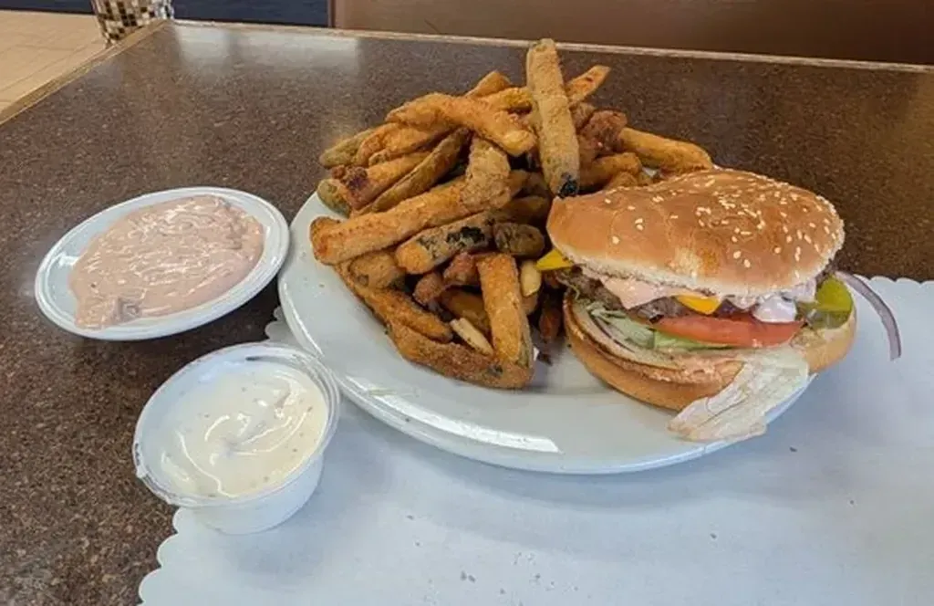 A cheeseburger with fried zucchini and two dipping sauces on the hamburgers menu at Harry's Cafe, Katella Ave, Stanton, CA