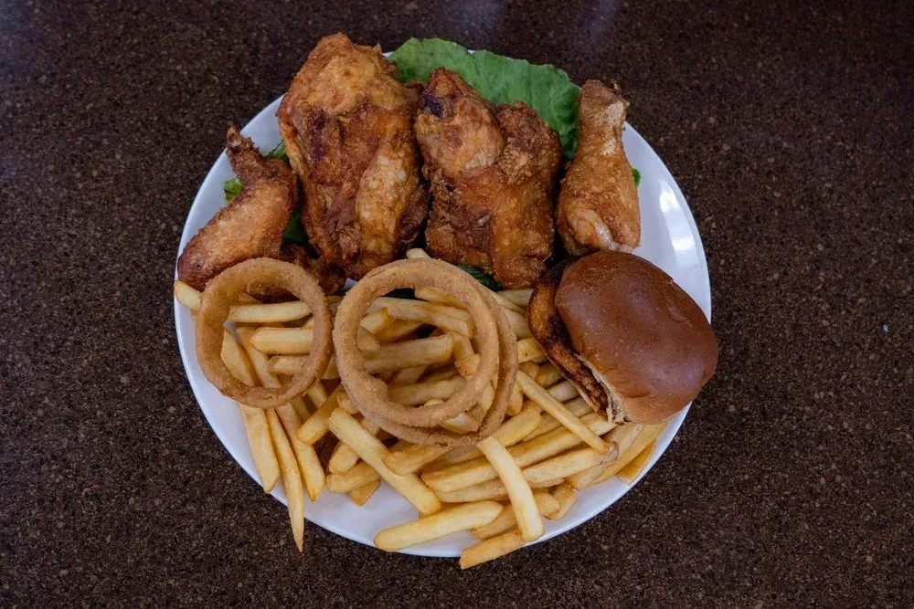 A steak plate with onion rings and a baked potato at Harry’s Cafe, Katella Ave, Stanton, CA.