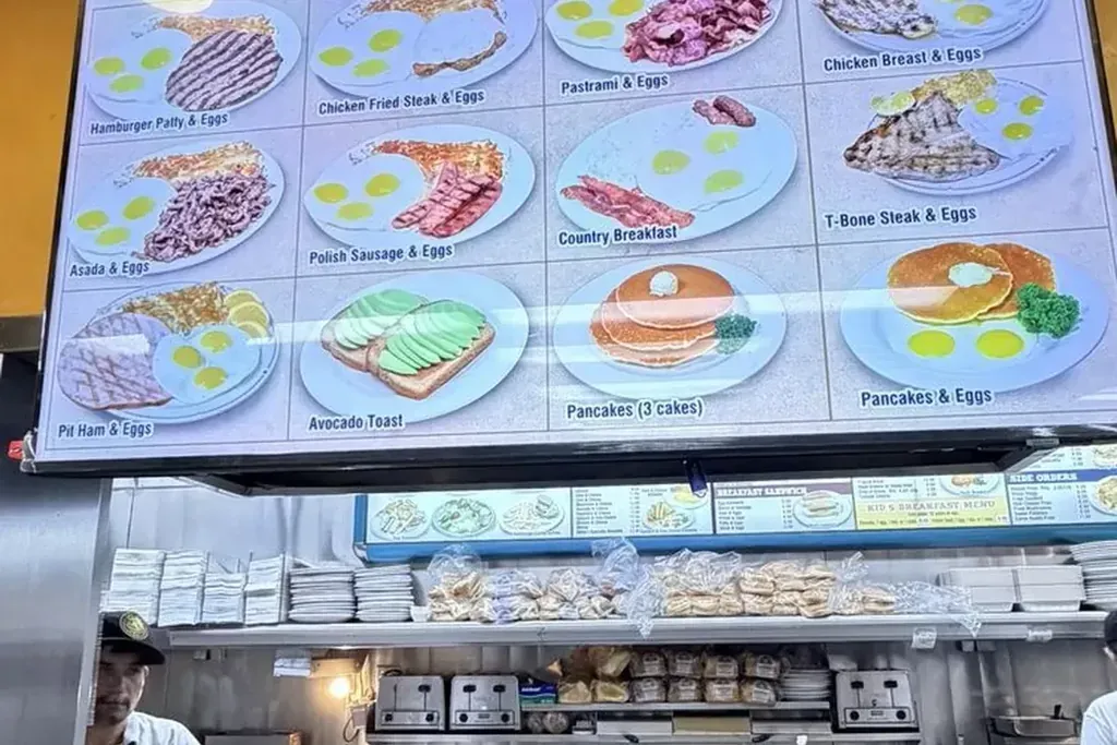 The breakfast menu screen above the counter at Harry's Cafe, Katella Ave, Stanton, CA
